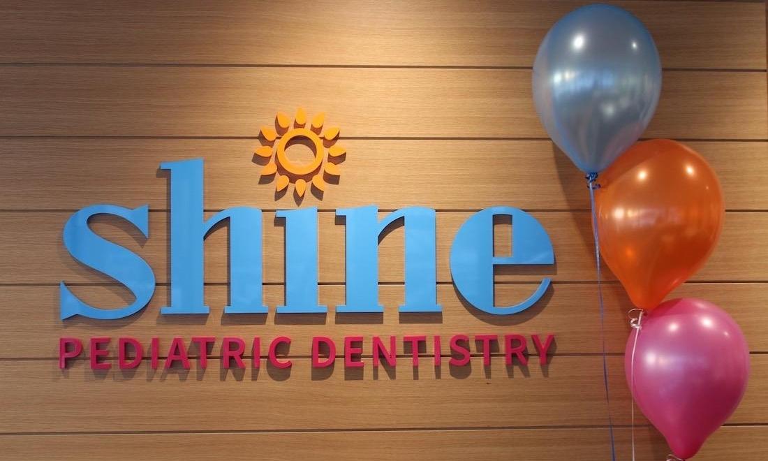 Logo sign behind our front desk